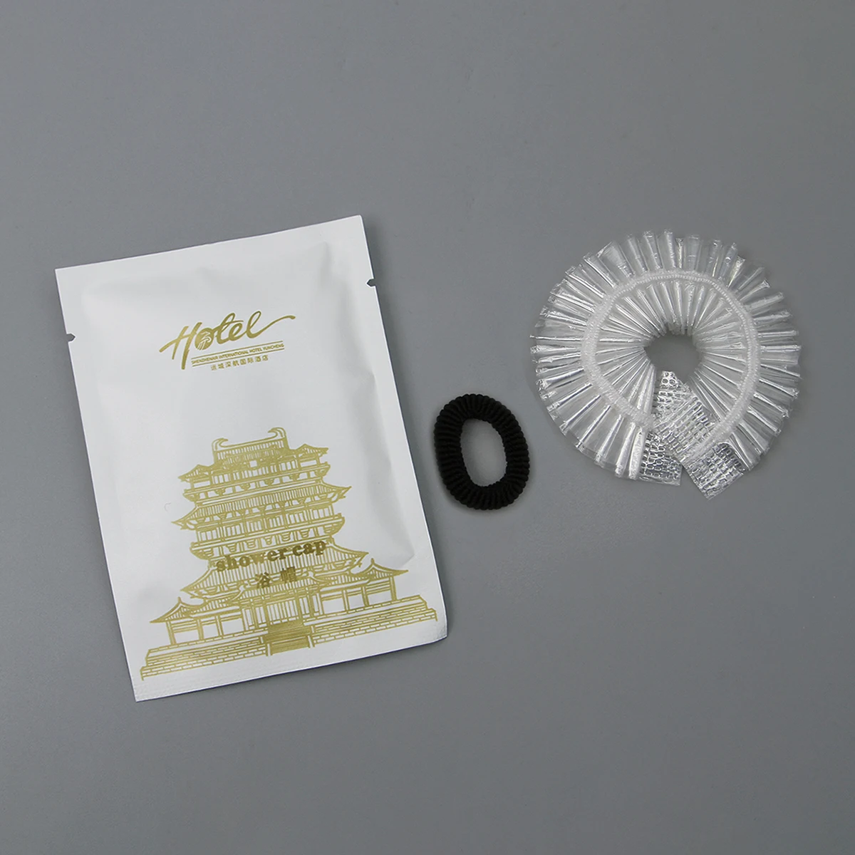 Gorro de ducha desechable personalizado de plástico PE impermeable para adultos, para salón y spa de hotel, cuidado del cabello: directo de fábrica